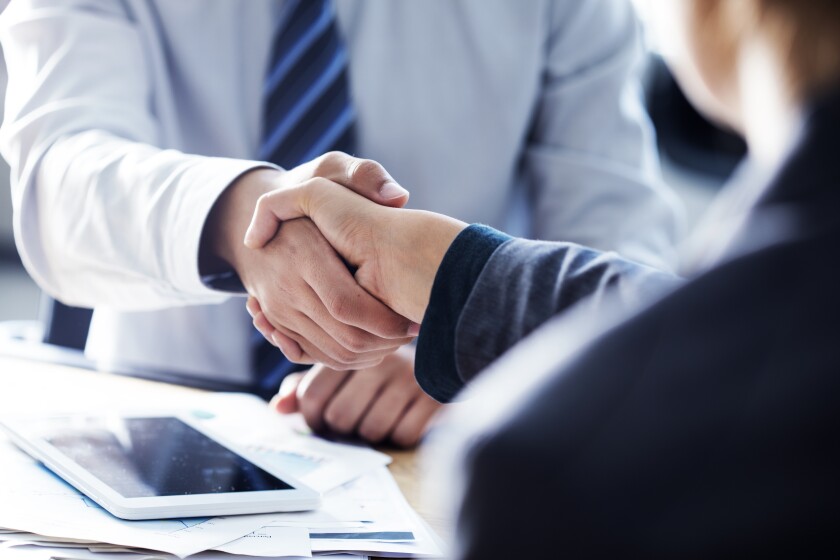 Business handshake in the office