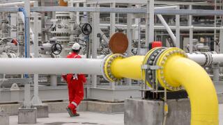 Vadu, Romania - June 28, 2022: Engineer works at a gas treatment plant.