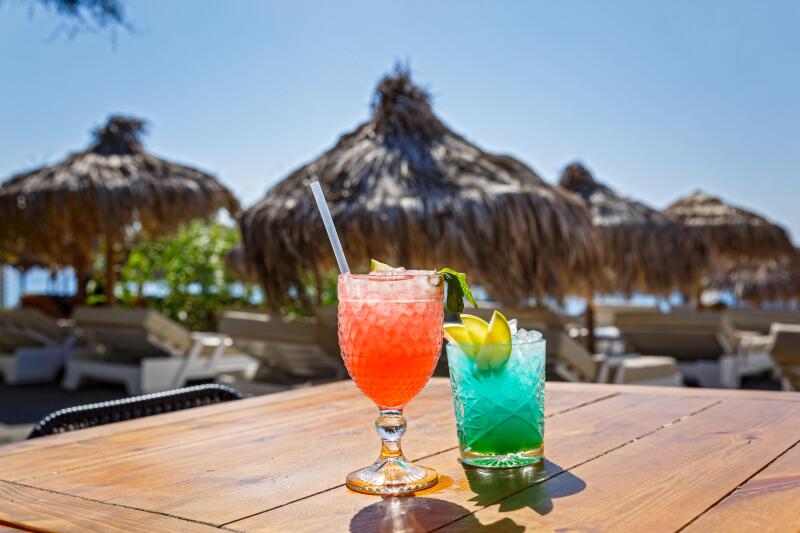 Two striking beach cocktail on wooden table