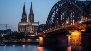 Cologne Cathedral, UNESCO World Heritage Site, and Hohenzollern Bridge at dusk, Cologne, North Rhine-Westphalia, Germany, Europe