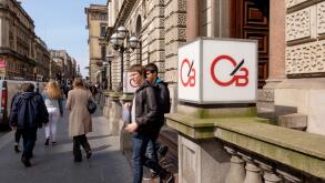 Customers leaving the entrance to Clydesdale Bank, Glasgow, Scotland, UK