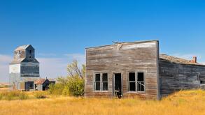 General store and grain elevator in ghost town Fusiller Saskatchewan Canada