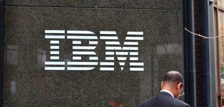 A businessman walks past the IBM building at 590 Madison Ave, New York in Midtown Manhattan.