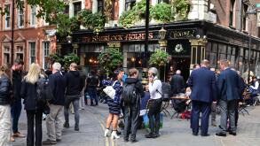 State funeral of Her Majesty Queen Elizabeth II, London, UK, Monday 19th September 2022. Drinkers in The Sherlock Holmes pub after the event.