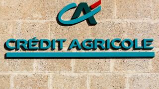 Credit Agricole logo on a wall