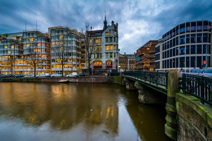 Buildings and bridge over the Singel Canal, in Amsterdam, The Netherlands.