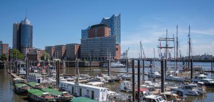 Elbphilharmonie Hamburg in sunshine, with ships and harbor in the foreground, Germany