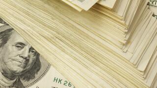 Background with big stack of one hundred dollar banknotes.