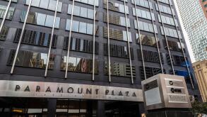 New York City, USA - August 3, 2018: Facade of the Paramount Plaza (Uris Building or 1633 Broadway) with people around on Broadway in Midtown Manhatta