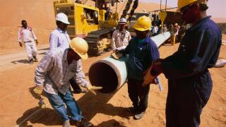 Laying pipeline in the remote Shaybah oil field in the empty quarter of Saudi Arabia to connect with the Dhahran facility.