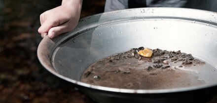 person panning for gold