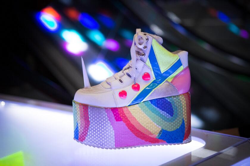 Camden Market unicorn disco platform shoes in Cyberdog, London, England, UK.