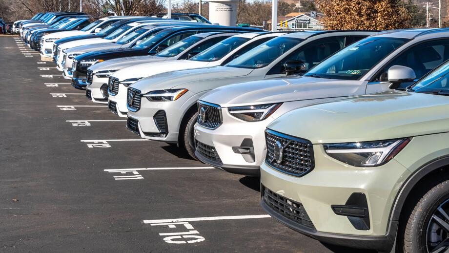 New Volvo vehicles lined up for sale at a dealership