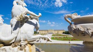 VIENNA, AUSTRIA - JULY 30, 2014: The Schonbrunn palace and gardens from Neptune fountain.