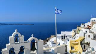Greek flag over the sea