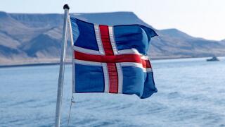Icelandic flag flying on a boat.