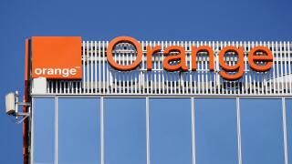Bucharest, Romania - August 16, 2021: A logo of Orange, French telecommunications company, is displayed on the top of a building, in 'Pipera' neighbor