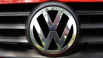 VW Logo on a red Volkswagen car