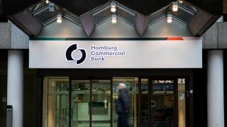 04 February 2019, Hamburg: Passers-by pass by the main entrance of the Hamburg Commercial Bank headquarters. Two months after the privatisation, HSH Nordbank now officially bears the new name Hamburg Commercial Bank. The change of name to a private commer