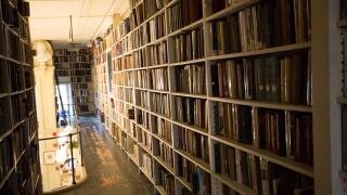 small library tight hallway bookshelves