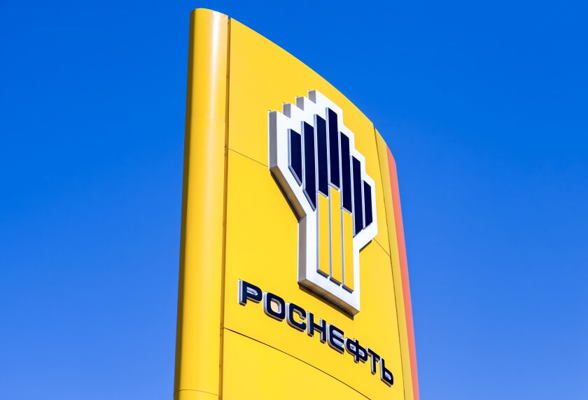 The emblem of the oil company Rosneft against the blue sky background