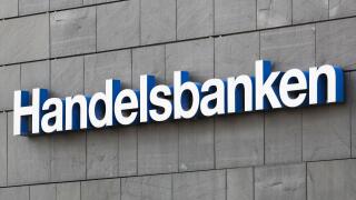 Aarhus, Denmark - August 7, 2020: Handelsbanken logo on a wall. Handelsbanken is a Swedish bank providing universal banking services