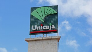 Sign over Unicaja bank, Torremolinos, Spain