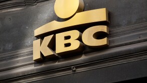 Gold KBC Bank logo on facade in Brussels, Belgium