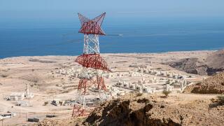High tension power lines overlooking Wadi Fins, Sultanate of Oman.