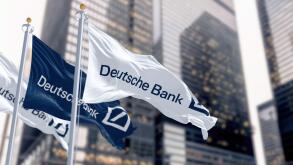 Berlin, DE, March 2023: Flags of Deutsche Bank waving in the wind in a financial district. On march 2023 Deutsche Bank suffered a stock market crash.
