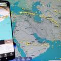 Flightradar24 mobile app displaying real-time global flight tracking map over the Middle East and Iran, aviation monitoring and commercial air traffic