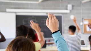 School classroom hands-up_4Sep23_alamy