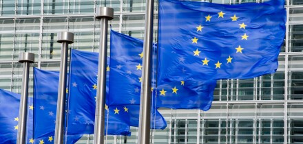 EU flags in front of European Commission in Brussels