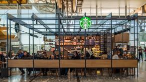 Oslo, Norway - Mar 28 2018 : Starbucks coffee with customers relaxation of located branch inside at Oslo international airport