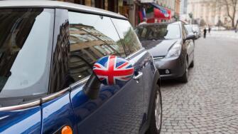 A Mini Cooper with the English flag on the mirror, Stockholm, Sweden.