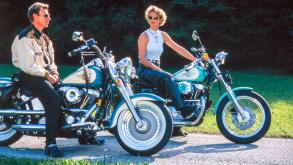 Couple by Harley Davidson motorcycles