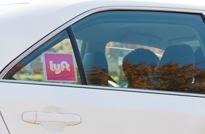 Lyft ridesharing sticker on car - Washington, DC USA