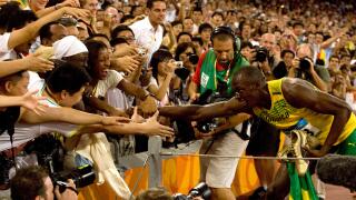 Jamaica's Usain Bolt jubilates with an adoring crowd after smashing the 100m world record with a time of 9.96 to win the Olympic men's 100m final in Beijing August 16, 2008. (UPI Photo/Stephen Shaver)