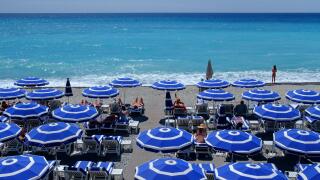 summer holiday beach umbrellas sunbathers sea sand