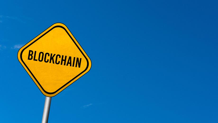 Blockchain - yellow sign with blue sky