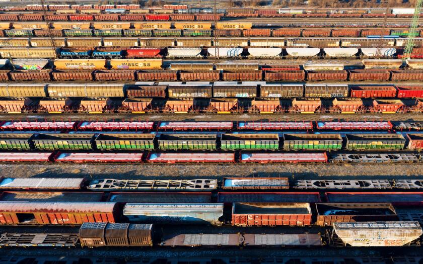 marshalling yard for railway cargo trains in Budapest. This is on Ferencvaros district. Aerial photo about lot empty and full trains.