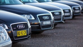 A Lineup of Luxury German Cars in a Used Car Yard
