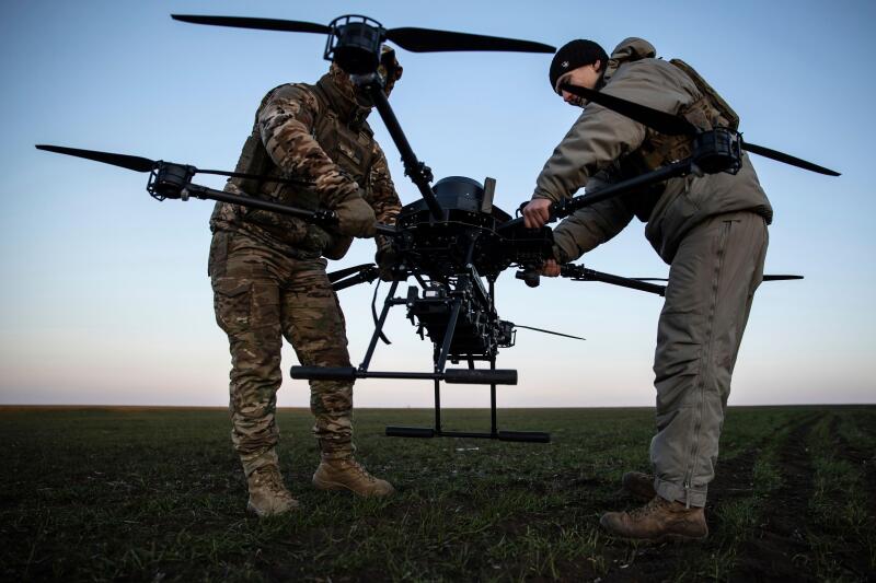 Ukrainian servicemen prepare a Vampire attack drone near the front line in the Donetsk region, Ukraine, Saturday, Feb. 8, 2025. (AP Photo/Roman Chop)