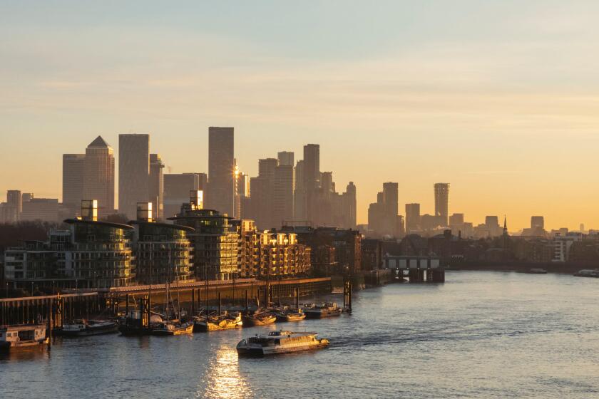 England, London, Docklands and Canary Wharf Skyline with River Thames