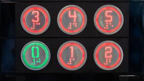 Elevator floor buttons on lift control panel at mall, hotel or business center