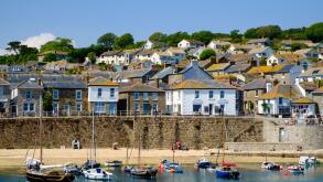 Old fishing village of Mousehole and harbour, West Cornwall, England, UK