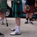 Scotland soccer fans with bagpipes wear kilts as they wait to enter the stadium for a Miami Marlins against the Texas Rangers baseball game after marching with the Tartan Army, Monday, June 22, 2026, in Miami. (AP Photo/Rebecca Blackwell)