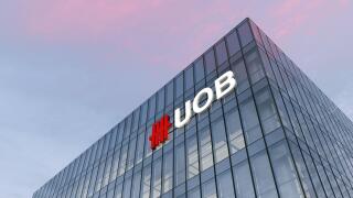 Singapore. February 27, 2021. Editorial Use Only, 3D CGI. UOB Signage Logo on Top of Glass Building. United Overseas Bank Corporation Company in High-