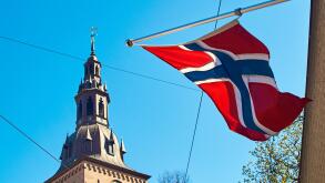Norwegin flag waving on a sunny spring day in Oslo, Norway