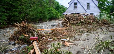 Plainfield, Vermont, USA. 11 July, 2024. Flood debris surrounds a house on Brook Road in Plainfield, VT, USA, after torrential rains from the remnants of Hurricane Beryl hit central Vermont, USA. John Lazenby/Alamy Live News